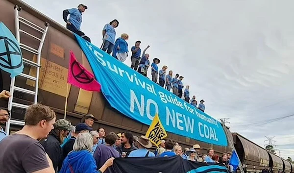 Up to 150 in attendance chanted and waved banners reading 'Survival guide for humanity: No new coal' (Rising tide/ Newcastle Facebook)