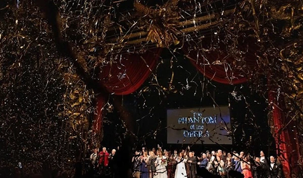 Cast and crew members take a final bow as confetti is released after the final performance of the Phantom of the Opera, which closes after 35 years on Broadway, in New York City, US, April 16, 2023. (Reuters)