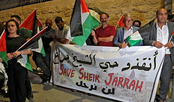 Palestinians in the occupied West Bank stage a protest in solidarity with Palestinian residents of Sheikh Jarrah neighborhood on May 10, 2021. (AFP)