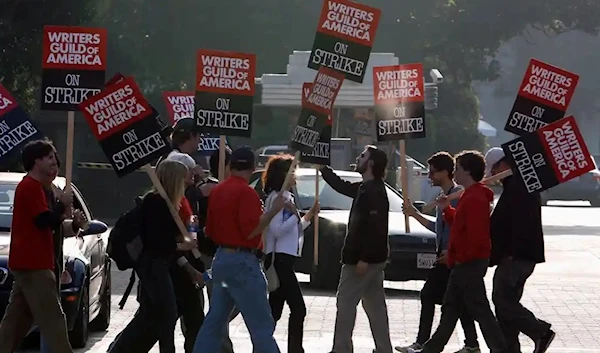 In this 2007 photo, members of the Writers Guild of America walk a picket line at Sony Studios in Culver City. (REUTERS)