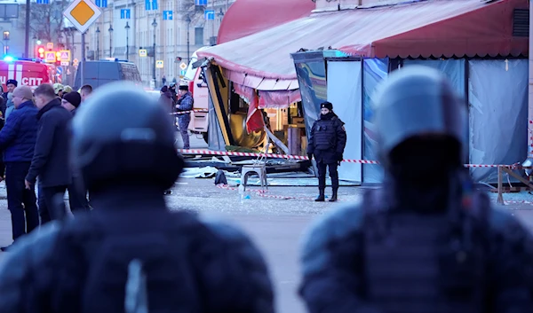 Russian police officers are seen at the site of an explosion at a cafe in St. Petersburg, Russia, Sunday, April 2, 2023 (AP Photo)