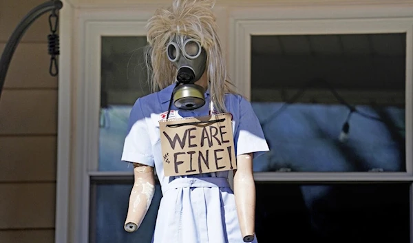 A resident displays a mannequin on their porch in East Palestine, Ohio, as cleanup from the Feb. 3 Norfolk Southern train derailment continues Friday. (AP)