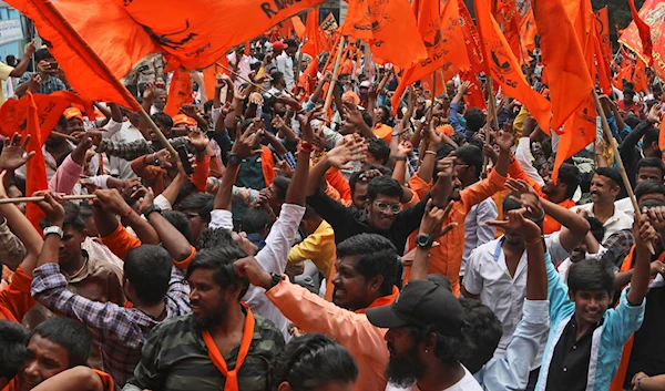 Hindus participate in a religious procession to mark the Hanuman Jayanti festival in Hyderabad, India, Saturday, April 16, 2022. (AP)