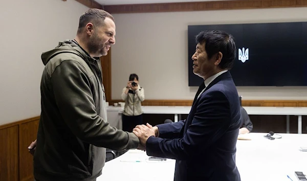 Andriy Yermak greets Morinari Watanabe before their meeting in Ukraine, 2 April 2023. (Twitter)