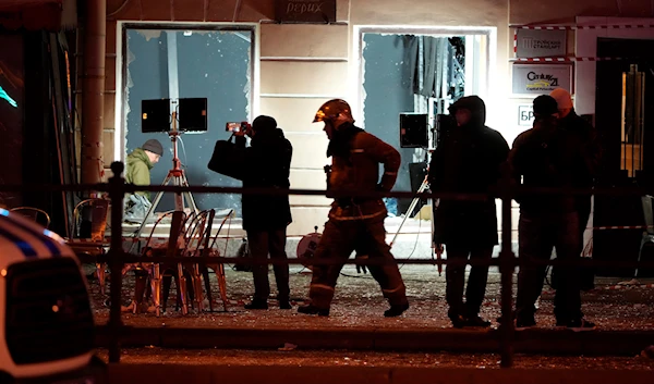 Russian investigators work at the side of an explosion at a cafe in St. Petersburg, Russia, April 2, 2023 (AP)