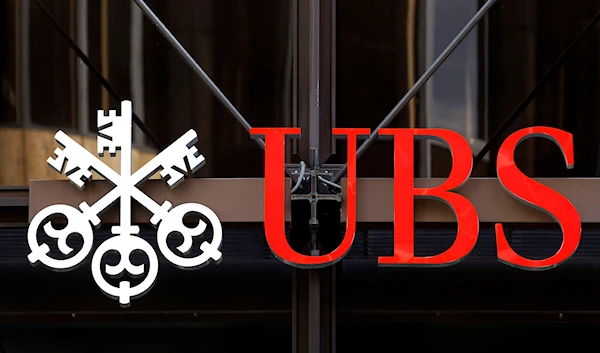 In this Sept. 15, 2011 file picture the logo for Swiss bank UBS is photographed outside one of their offices in the City of London. (AP)