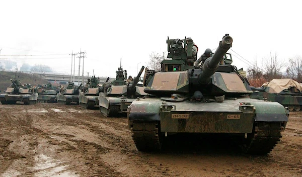 In this Dec. 10, 2015, U.S. M1A2 SEP Abrams battle tanks prepare to cross the Hantan river during a river crossing operation, part of an annual joint military exercise between South Korea and the United States (AP Photo/Ahn Young-joon)