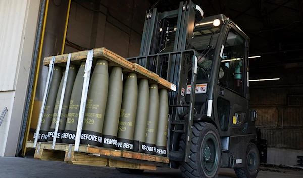 Airmen with the 436th Aerial Port Squadron use a forklift to move 155 mm shells ultimately bound for Ukraine, April 29, 2022, at Dover Air Force Base, Delaware (AP)