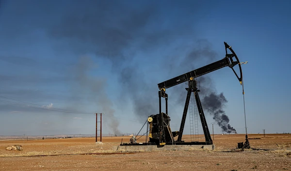 A smoke rises from an oil depot struck by the Turkish air force near the town of Qamishli, Syria, November 23, 2022 (AP)