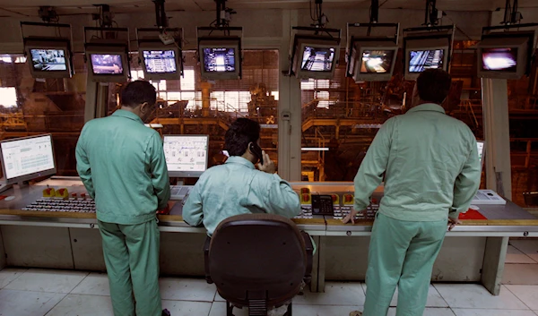 Iranian workers monitor a part of the production line at the Mobarakeh Steel Complex, some 280 miles (460 kilometers) south of the capital Tehran, Iran, May 31, 2012 (AP)