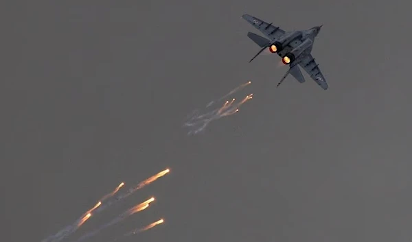 A Polish Air-Force MiG-29 sends out flares in a performance at the Radom Air Show, 24 August 2013. (Reuters)