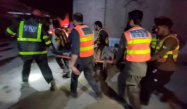 Rescue workers remove an injured victim from the site of a bomb explosion, in Kabal, an area of Pakistan's Swat Valley, Monday, April 24, 2023. (AP)