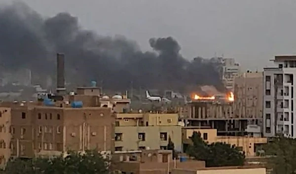 Smoke rises from the tarmac of Khartoum International Airport as a fire burns, in Khartoum, Sudan April 17, 2023. (REUTERS)