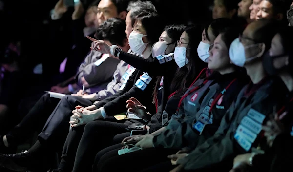 Staff watch the livestream of HAKUTO-R private lunar exploration program on screen during the lunar landing event Wednesday, April 26, 2023, at Miraikan, the National Museum of Emerging Science and Innovation, in Tokyo. (AP)