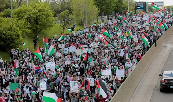 Demonstrators March in a pro-Palestinian protest in Dearborn, Michigan, US, 16 May 2021.