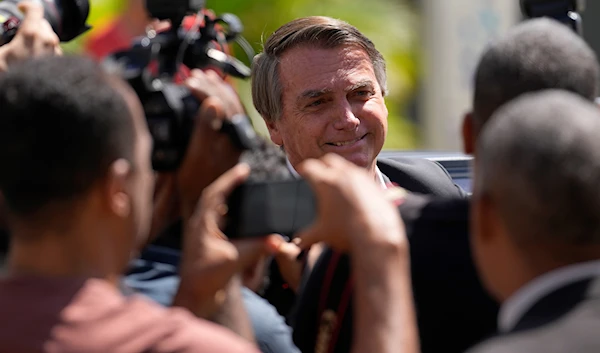 Former Brazilian President Jair Bolsonaro leaves Federal Police headquarters after giving testimony over the Jan. 8 attacks in Brasilia, Brazil, Wednesday, April 26, 2023. (AP)