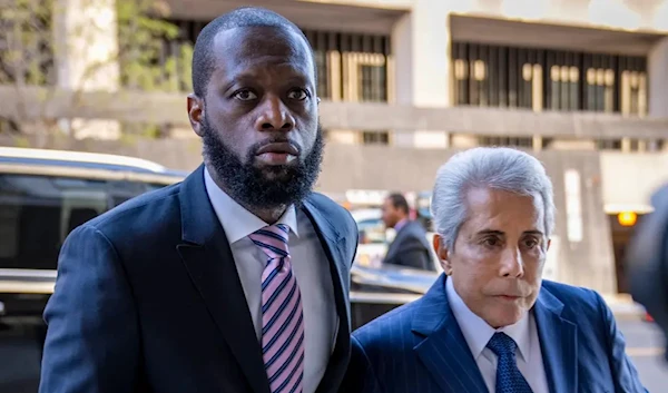 fghjkldefense lawyer David Kenner, right, arrives at federal court for his trial in an alleged campaign finance conspiracy on March 30, 2023 (Reuters)