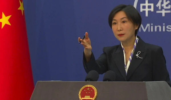 Chinese Foreign Ministry spokesperson Mao Ning gestures during a press conference at the Ministry of Foreign Affairs in Beijing, Wednesday, March 1, 2023 (AP)