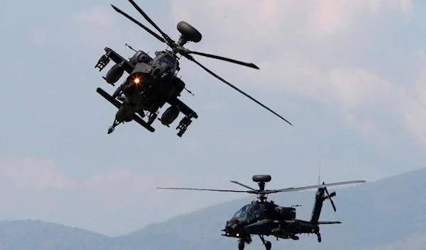 Two Apache helicopters during a training flight (AP)