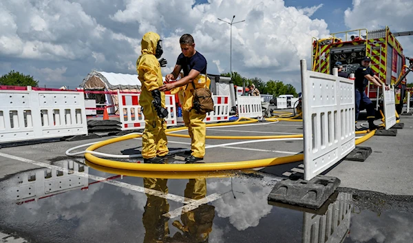 Members of the State Emergency Service prepare for nuclear disaster response drills during the shelling of the Zaporozhye Nuclear Power Plant on August 17, 2022 (Reuters)