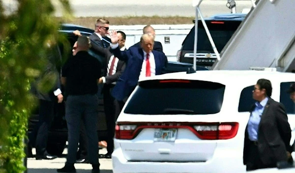 Former US President Donald Trump before he boards his plane in Florida, bound for New York (AFP)