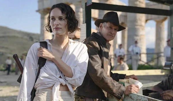 This image released by Lucasfilm shows Phoebe Waller-Bridge, left, and Harrison Ford in a scene from "Indiana Jones and the Dial of Destiny." (AP)