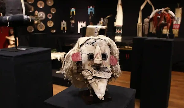 A Puebloan Kachina Huhuwa mask displayed for sale among other Native American artifacts at a 2014 Paris auction, France. (AFP)