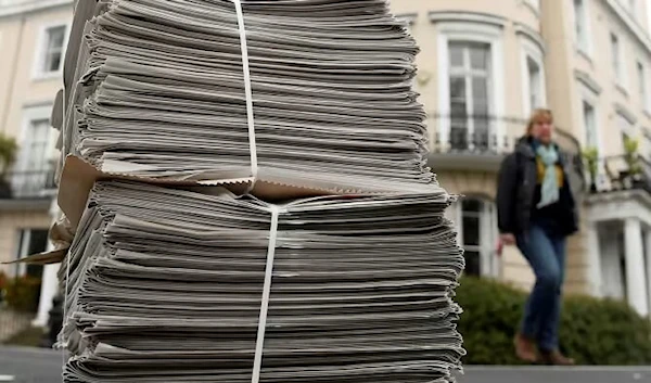 A pile of Evening Standard newspapers on a pavement in London. The freesheet is experimenting with home delivery as commuters stay at home. (Reuters)