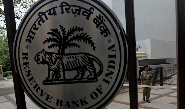 A security guard stands outside the Reserve Bank of India (RBI) head office in Mumbai, India, Tuesday, July 26, 2011. (AP)