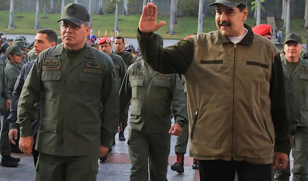 In this photo released by Miraflores Press Office, Venezuela's President Nicolas Maduro, right, accompanied by his Defense Minister Vladimir Padrino Lopez, waves upon his arrival to Fort Tiuna, in Caracas, Venezuela, Thursday, May 2, 2019. (AP)