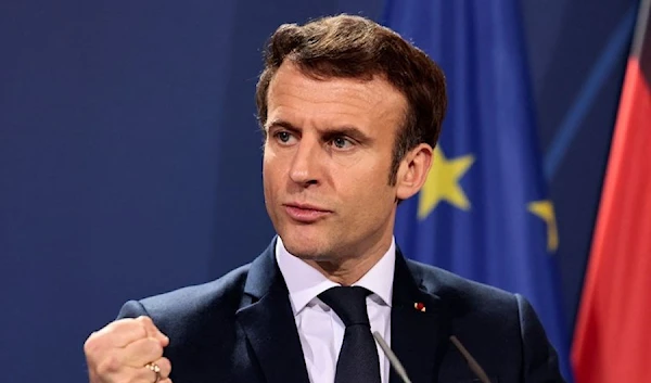 French President Emmanuel Macron speaks to the media ahead of a Weimar Triangle meeting to discuss the ongoing Ukraine crisis, in Berlin, Germany, February 8, 2022. (REUTERS)