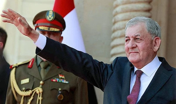 Newly elected President Abed El Latif Rashid waves during his inaguartion at Al-Salam Palace in Baghdad, Iraq, 17 October 2022. (AFP)