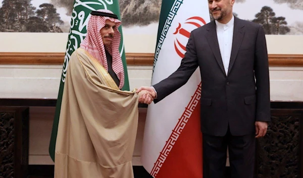 In this picture released by the Iranian Foreign Ministry, Foreign Minister Hossein Amirabdollahian, right, and his Saudi Arabian counterpart Prince Faisal bin Farhan Al Saud shake hands during their meeting in Beijing China, Thursday, April 6, 2023. (AP)