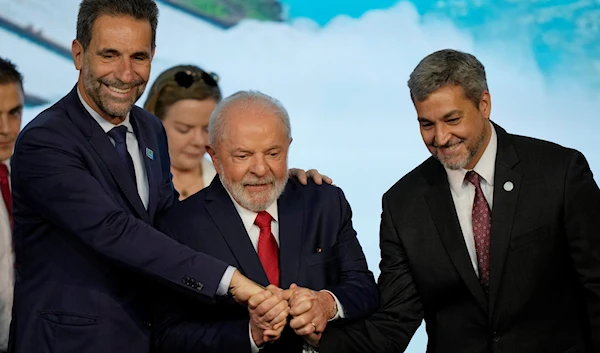 Brazil's President Luiz Inacio Lula da Silva, center, Paraguay's President Mario Abdo Benitez, right, at the Itaipu hydroelectric dam on their shared border in Foz do Iguaçu, Brazil, Thursday, March 16, 2023 (AP)