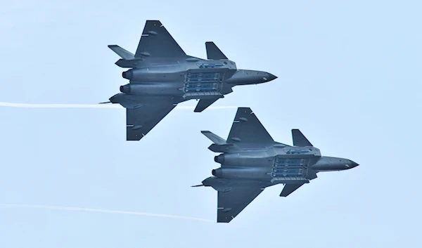 Chengdu J-20 stealth fighter jets of Chinese People's Liberation Army (PLA) Air Force perform with open weapon bays during the China International Aviation and Aerospace Exhibition, in Zhuhai, Guangdong province, China November 11, 2018 (Reuters)