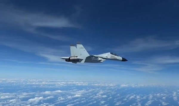 Chinese J-11 fighters jets fly in close proximity to US RC-135 aircraft over South China Sea according to the US military, in a still image taken from a video reocrded on 21 December 2022. U.S. Indo-Pacific Command/Handout via (Reuters)