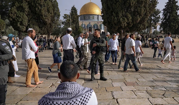 Israeli occupation forces escorting illegal Israeli settles to Al-Aqsa Mosque compound in the Old City of occupied Al-Quds, April 9, 2023 (AP)