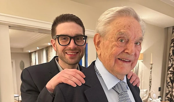 Instagram photo posted on Alexander Soros' personal account where he stands behind his father George Soros at Munich Security Conference, 17 February 2023. (@alexsoros/Instagram)