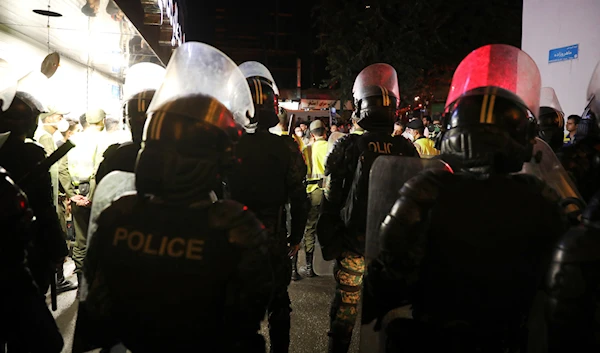 Anti-riot police officers stand outside the Sina Athar Clinic after its explosion, in Tehran, Iran, early Wednesday, July 1, 2020. (AP)