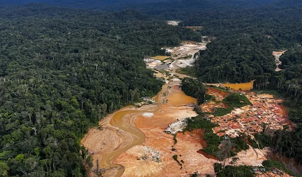 Aerial picture showing an illegal mining camp, known as garimpo, during an operation by the Brazilian Institute of Environment and Renewable Natural Resources (IBAMA) against Amazon deforestation at the Yanomami territory in Roraima State, Brazil. (AFP)