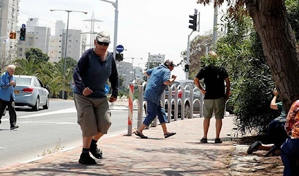 A still image from one of the videos on Social Media depicting the collective escape of israeli settlers as the Resistance launches new barrages of rockets toward their settlements, Occupied Palestine May 12, 2023. (Social Media)