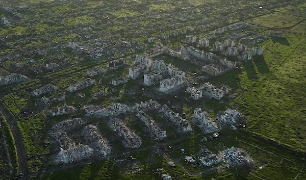 Residential buildings razed to the ground and shell craters are seen on an aerial view of Maryinka, an eastern city where heaviest battles with the Russian troops have been taking place in the Donetsk region, Ukraine, May 11, 2023 (AP)