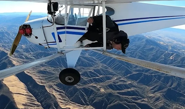 A video still showing YouTuber Trveor Jacob about to jump from his plane (YouTube/Trevor Jacob)