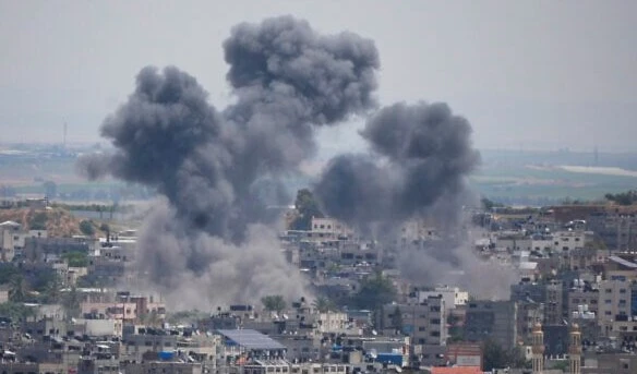 Smoke rises from an Israeli airstrike on a residential area in Gaza Strip, on May 12, 2023. (AP)