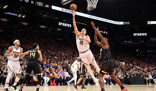 Nikola Jokic of the Denver Nuggets attempts a lay up during the Nuggets' game 6 win over the Phoenix Suns, 11 Ma 2023. (AFP)