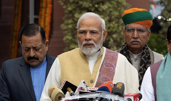 India's Prime Minister Narendra Modi speaks with the media inside the parliament premises upon his arrival on the first day of the budget session in New Delhi, India, January 31, 2023 (Reuters)