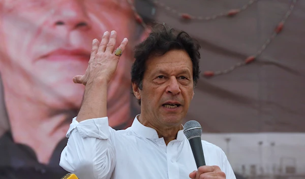 Imran Khan, chairman of the Pakistan Tehreek-e-Insaf (PTI), gestures while addressing his supporters during a campaign meeting ahead of general elections in Karachi, Pakistan, July 4, 2018 (Reuters)