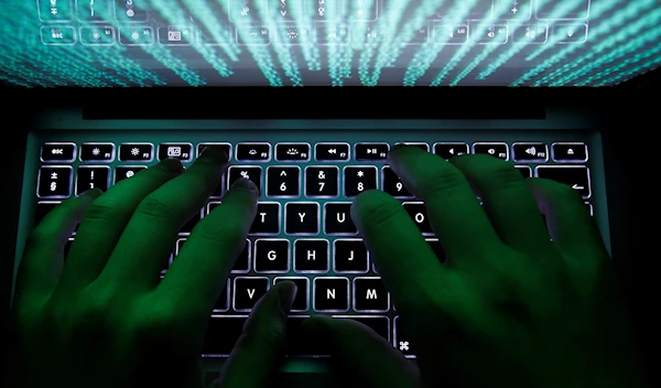 A man types on a computer keyboard in Warsaw in this February 28, 2013 illustration file picture. (Reuters)