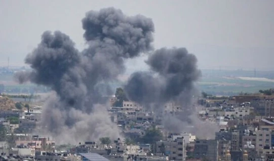 Smoke rises from an explosion caused by an Israeli airstrike the in Gaza Strip, May 12, 2023. (AP)