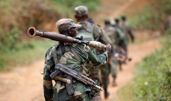 Democratic Republic of Congo military troops patrol an area near Beni in North-Kivu province, 13 December 2013. (Reuters)